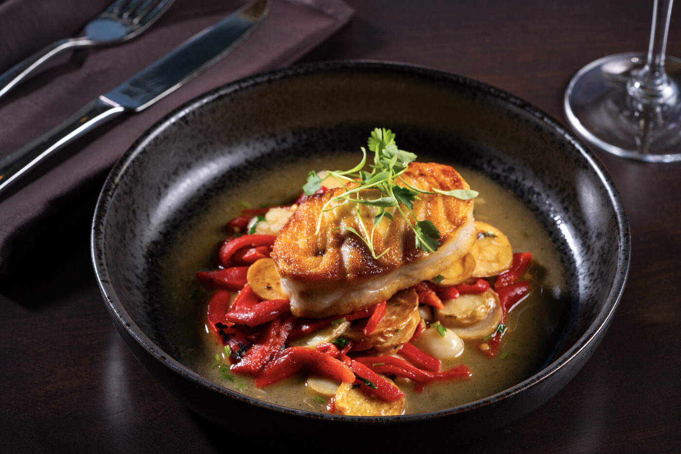 Chilean sea bass over fingerling potato and piquillo pepper broth