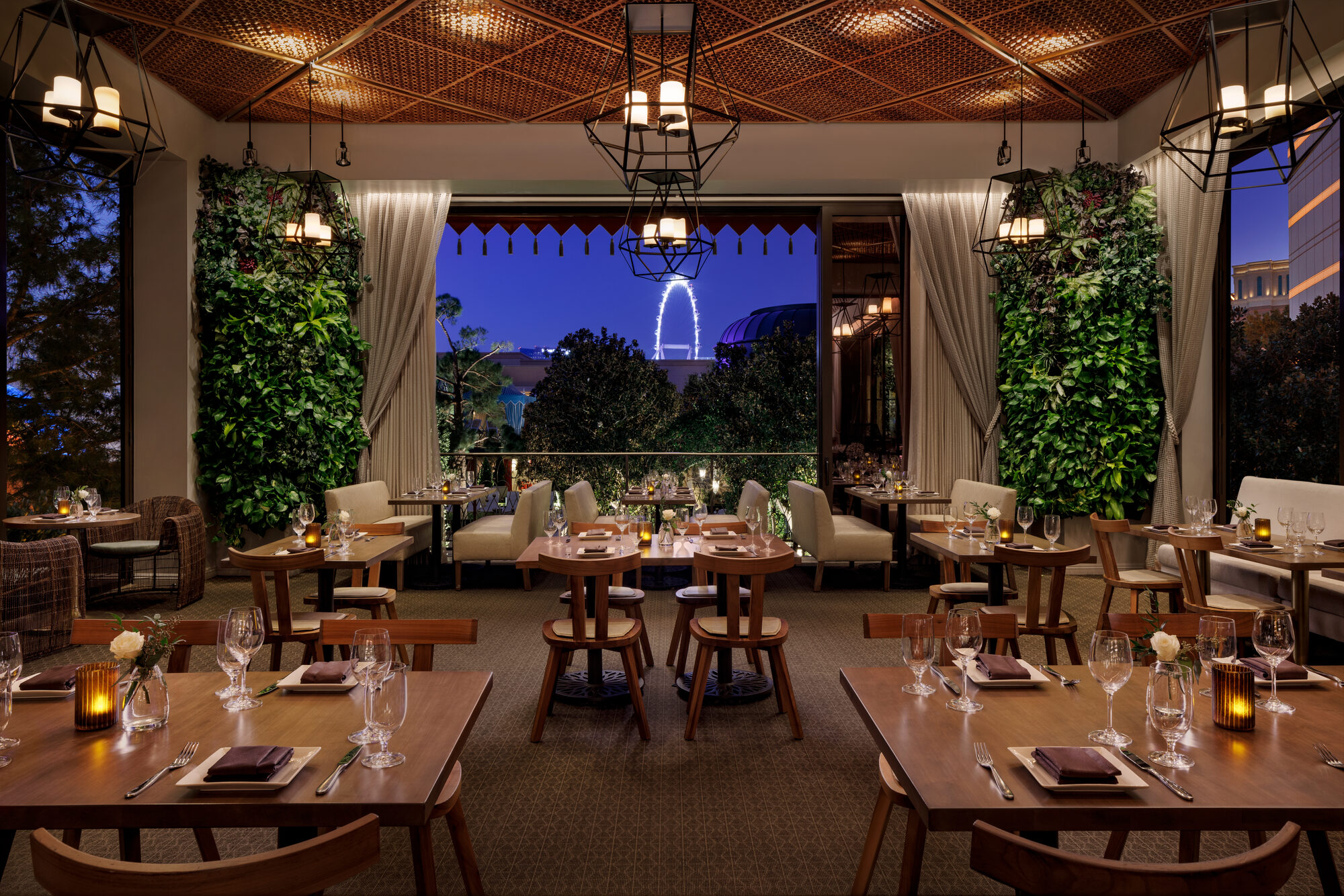 The Garden Room with retractable glass walls open onto the Wynn Pool & Gardens